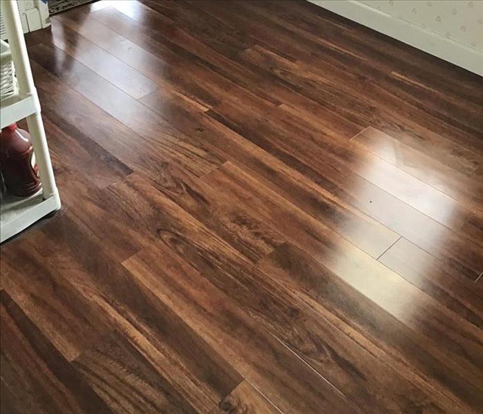 In this image is a fully restored and polished hardwood floor 