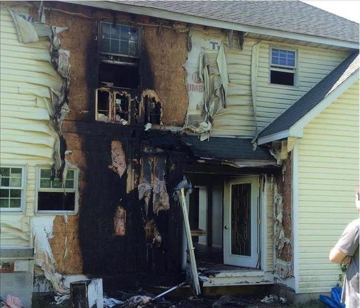 A picture of a house fire due to an air conditioner. 