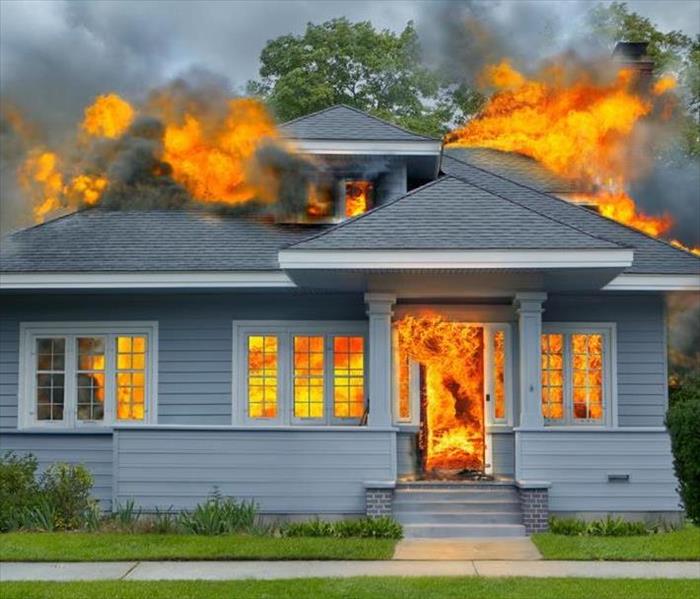 A picture of a house burning